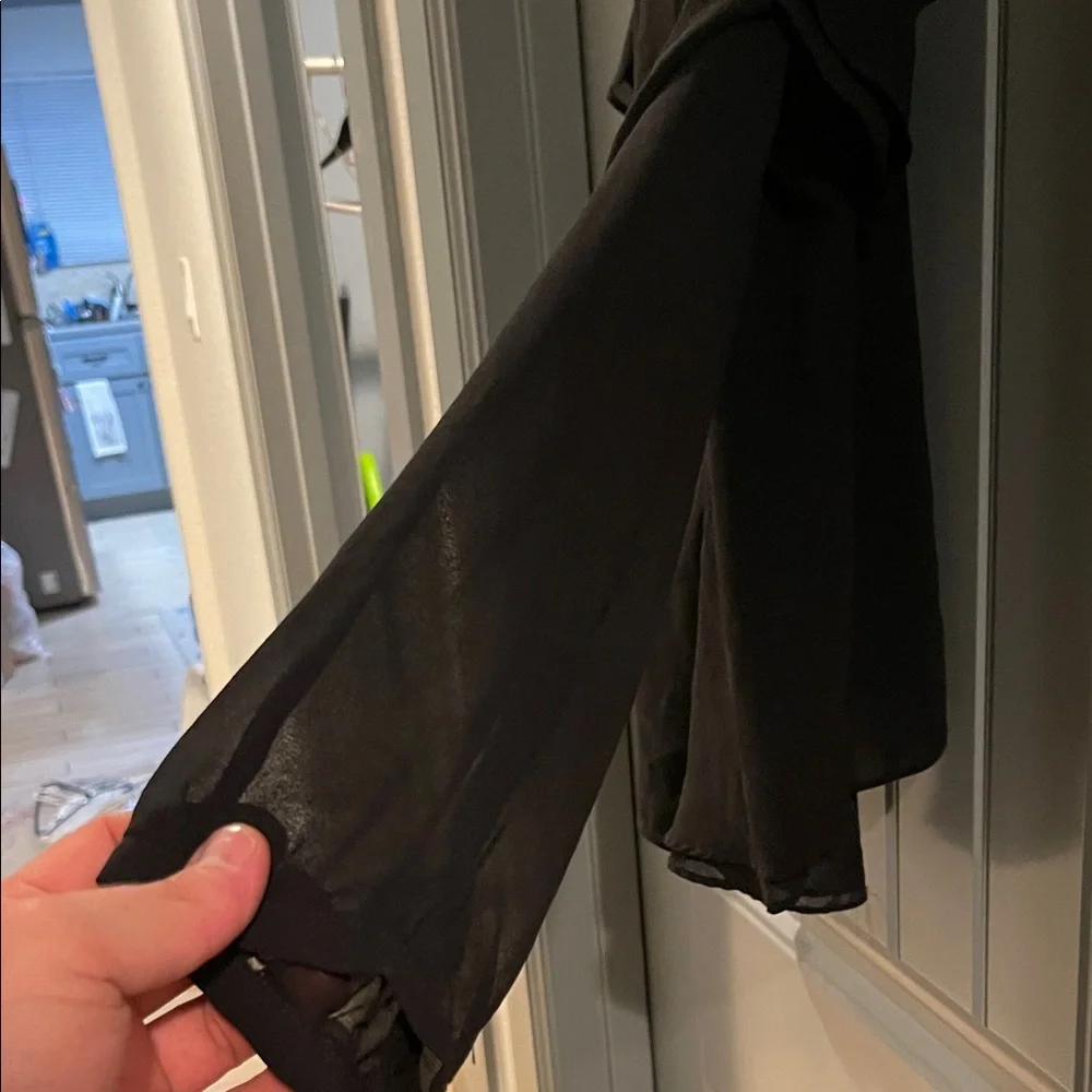 Chic Black Ruffle Sleeveless Blouse - Picture 6 of 7